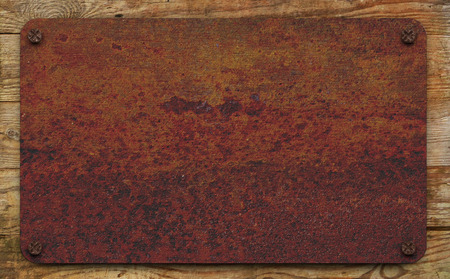 Rusty plate on the horizontal boardsの写真素材