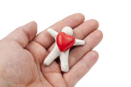 plasticine heart in your handの写真素材