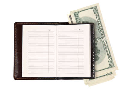 notebook and money on a white backgroundの写真素材