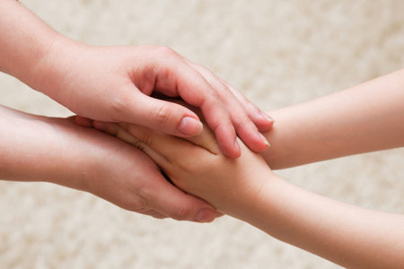 hands of mother and daughterの写真素材
