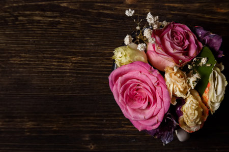 dark wooden background with withered flowers, autumn, end of summer
