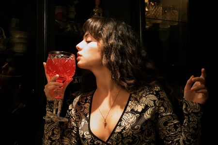 Portrait of the girl with a glass of wineの写真素材