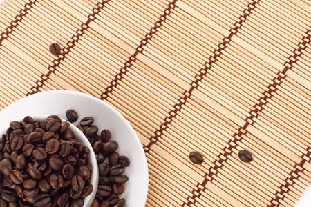 Coffee beans in a white cupの写真素材