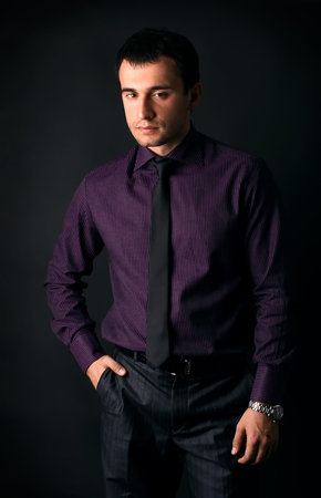 young man on a black backgroundの写真素材