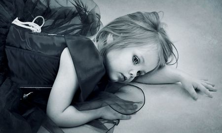 Portrait of the beautiful girl in a red dressの写真素材