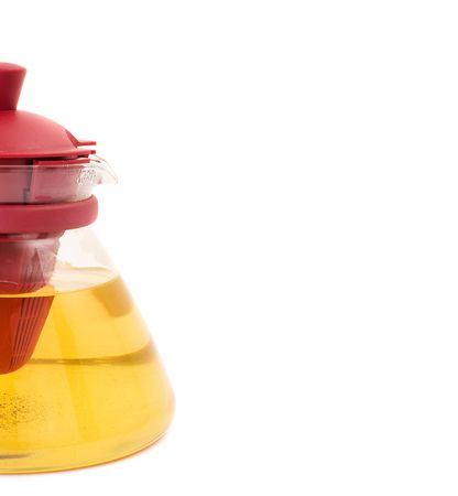 series. A glass teapot isolated on a white background. Green teaの写真素材