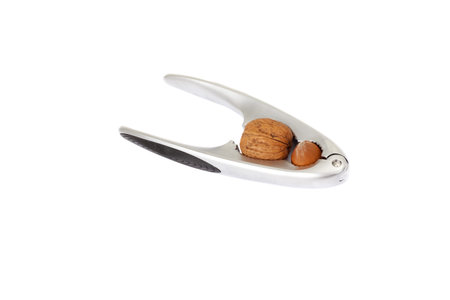 Series. walnut in a nutcracker on white background