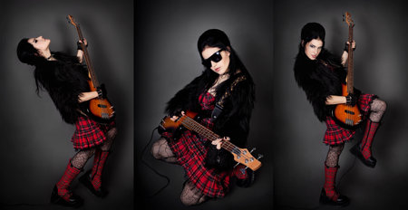 series. Fashion style photo of young rocked woman in studio  with guitarの写真素材