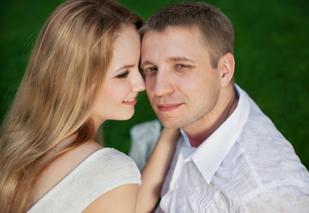 Portrait of young happy smiling cheerful attractive couple together, outdoorsの写真素材