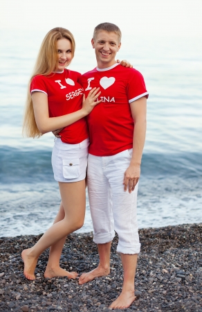 Portrait of young happy smiling cheerful attractive couple together, outdoorsの写真素材