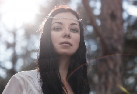 portrait of carefree young woman in white dressの写真素材