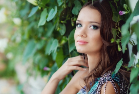 young beautiful girl walks in the parkの写真素材