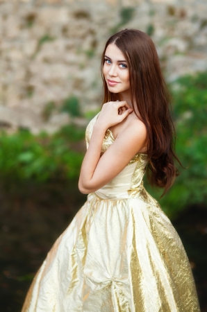 A girl in a colorful dress and the ruins of ancient Chersoneseの写真素材