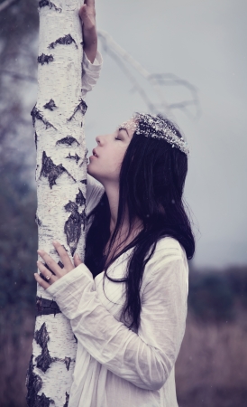 portrait of carefree young woman in white dressの写真素材