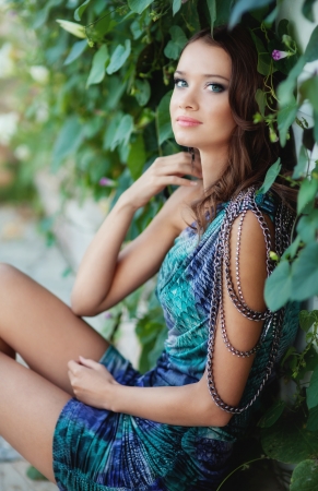 young beautiful girl walks in the parkの写真素材