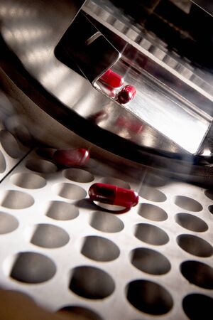 Pharmaceutical pills production. View inside conveyor.の写真素材