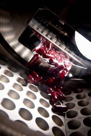 Pharmacological pills production. Inside conveyor.の写真素材