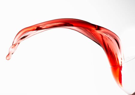 Rose wine splashing on whiteの写真素材