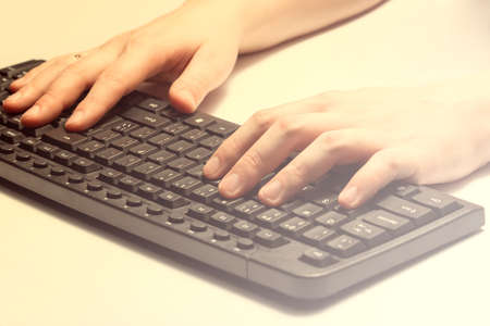Hands on a computer keyboardの写真素材