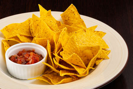 nachos with sauce on a plateの写真素材