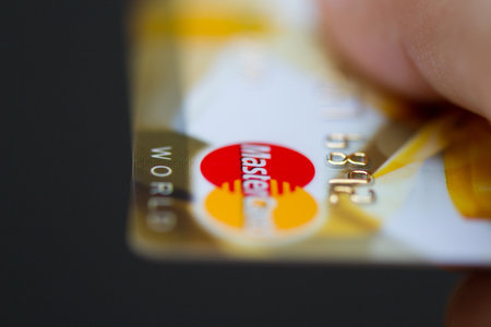 MOSCOW, RUSSIA-July 29, 2015:Man holding mastercard bank credit cards.のeditorial素材