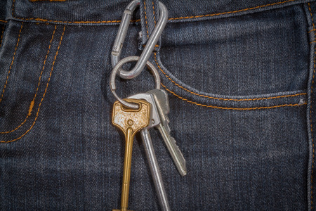 Bunch of keys on the jeans. Texture, background.の写真素材