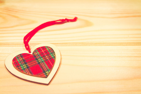 Christmas wooden ornaments toy heart with ribbon .の写真素材