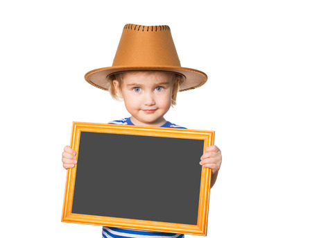 Little Funny girl in striped shirt and hat with blackboard. Isolated on white backgroundの写真素材