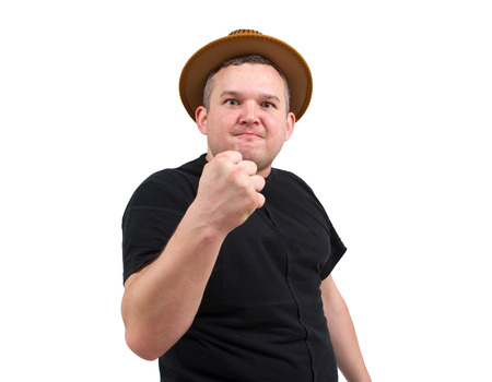 Gangster in  hat angry man holding fists against.  Isolated white backgroundの写真素材