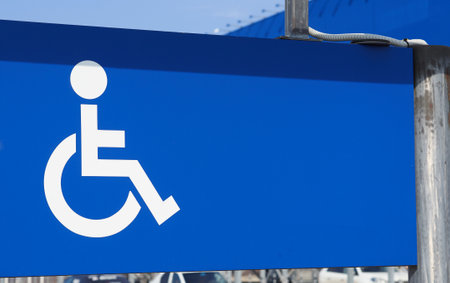 Parking for disabled persons sign. White on blue.のeditorial素材