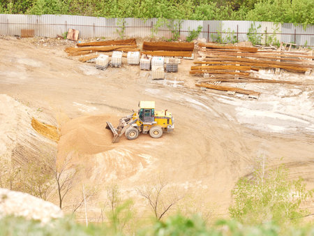 Tractor working on the construction site. View from above.
