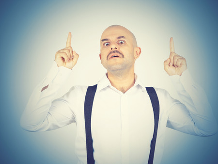 Idea. Mustache bald man shows finger up  の写真素材