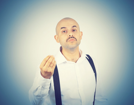 Bald funny man sends a air kiss to the camera. の写真素材