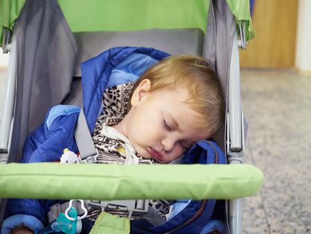 Little baby sleeping in a stroller.の写真素材