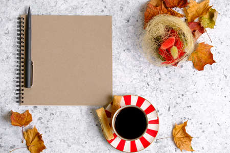 Coffee in a cup, cookies and notepadの写真素材