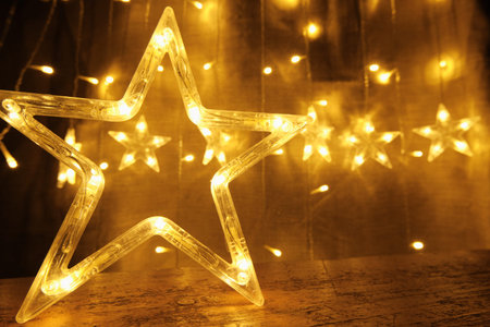 Glowing garland of stars. Christmas and New Year. Festive Decorations for Christmas and New Year.の写真素材