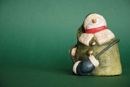 Snowman and Green Background. Festive Decorations for Christmas and New Year.の写真素材