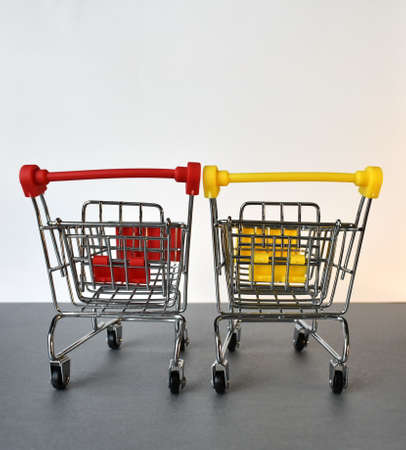 Two empty supermarket carts. Located next to each other.の写真素材
