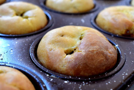 Hand-made Apple cupcakes in a baking dish close-upの写真素材
