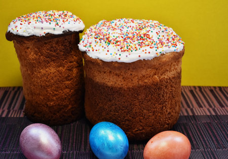 Two Easter homemade Easter cake and three Easter eggsの写真素材
