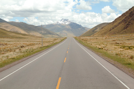 Straight and beautiful rocky road in highland Peruvian Andesの写真素材