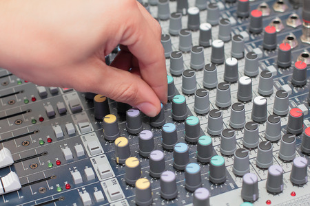 Sound producers hand on mixerの写真素材