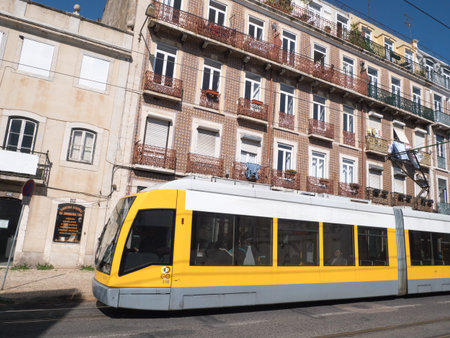 Beautiful Modern yellow tram running on rails