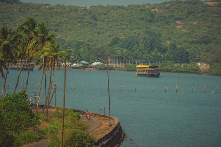 Houseboat on the river near the roadの写真素材