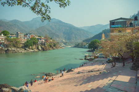 Laksman Jhula bridge across the Ganges River and ghats in Rishikeshの写真素材
