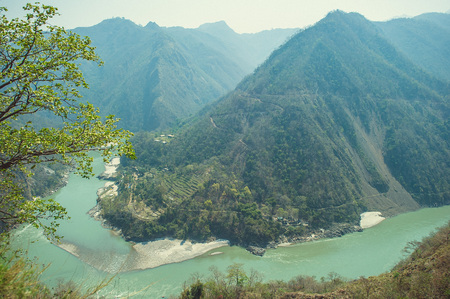 The Ganges River flowing through the canyon in the Himalayas Mountainsの写真素材