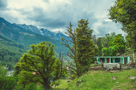 In the front Vashisht village on background Himalayan mountans and blue sky with cloudsの写真素材