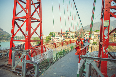 Rishikesh. India. April 13, 2017. Pilgrims walk through the suspension bridgeのeditorial素材