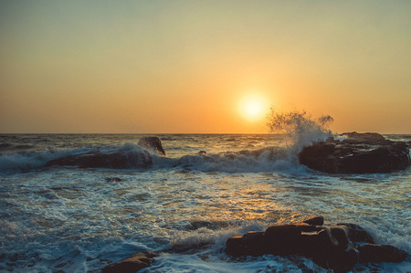 Arabian Sea and rocks against the backdrop of sunset.の写真素材