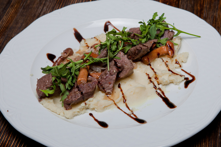 Boar meat fried with onions and pidpenkamy harnirovane mashed potatoesの写真素材
